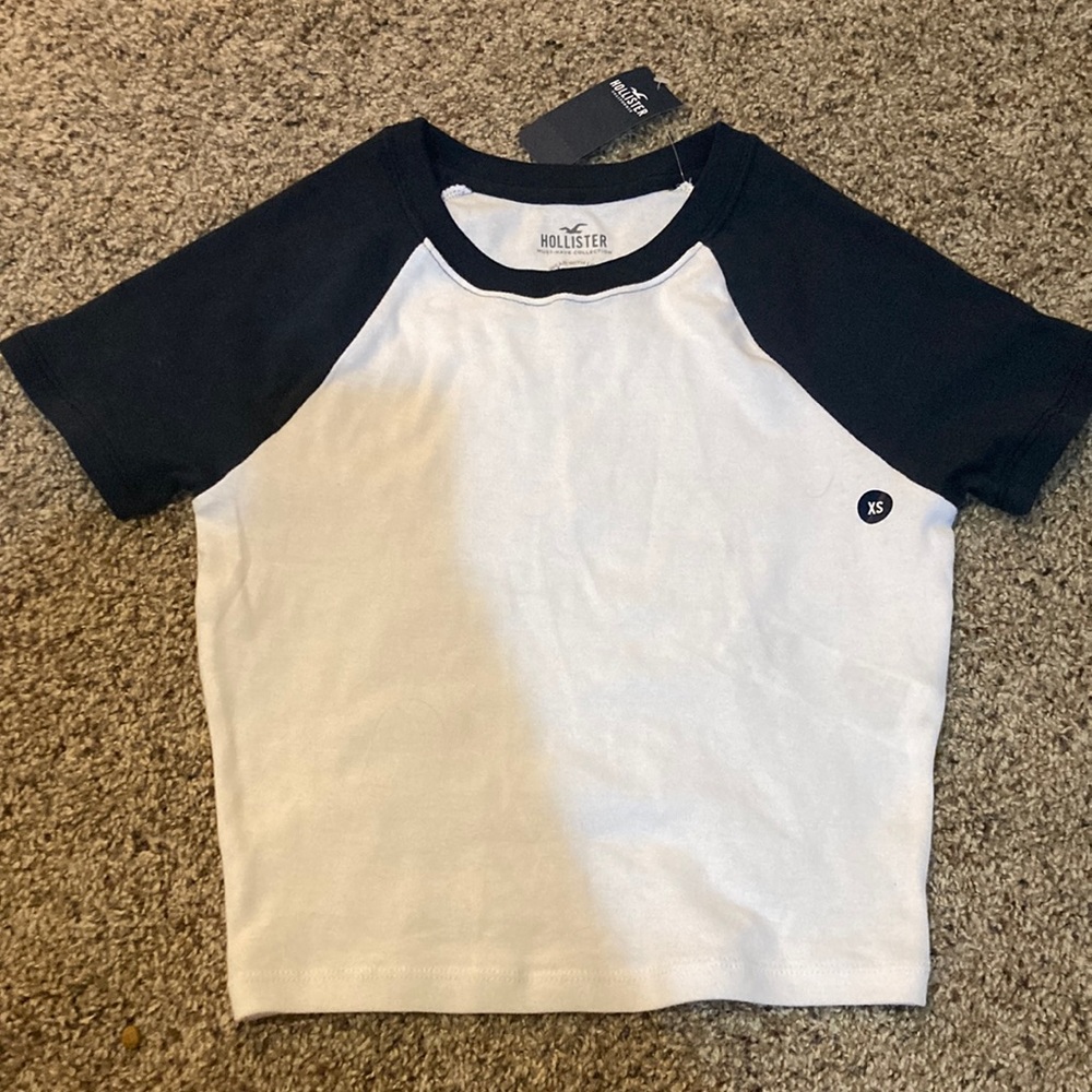 Navy blue sleeves and white body t shirt.